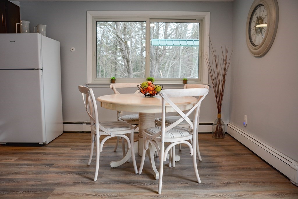 144 Partridgeville Road Templeton, MA 01468 - Photo 5 of 33 a dining room with furniture a window and wooden floor