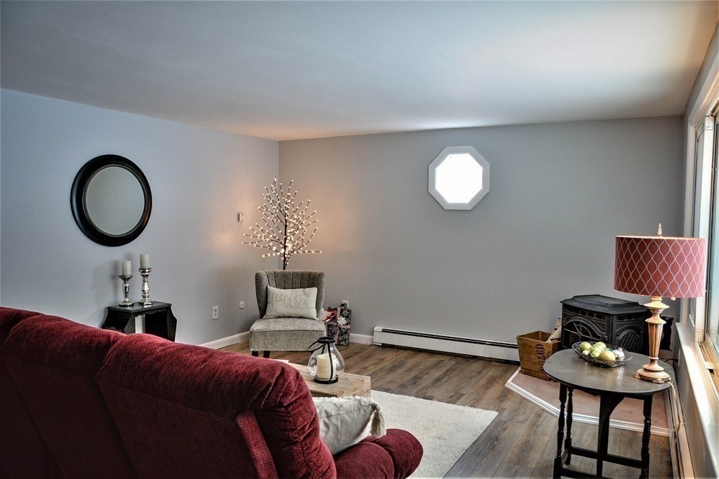 144 Partridgeville Road Templeton, MA 01468 - Photo 7 of 33 a living room with furniture and a mirror