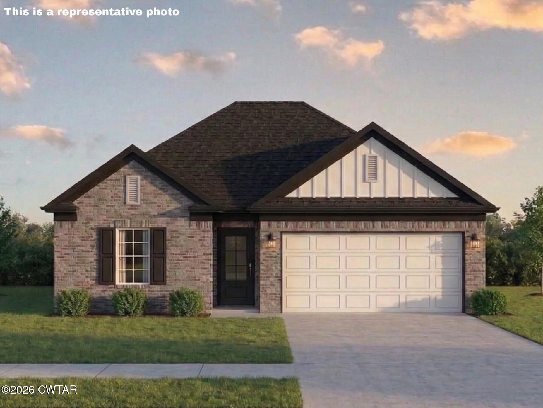 6 Cecellia Cove Jackson, TN 38305 - Photo 1 of 11 a front view of a house with a yard and garage