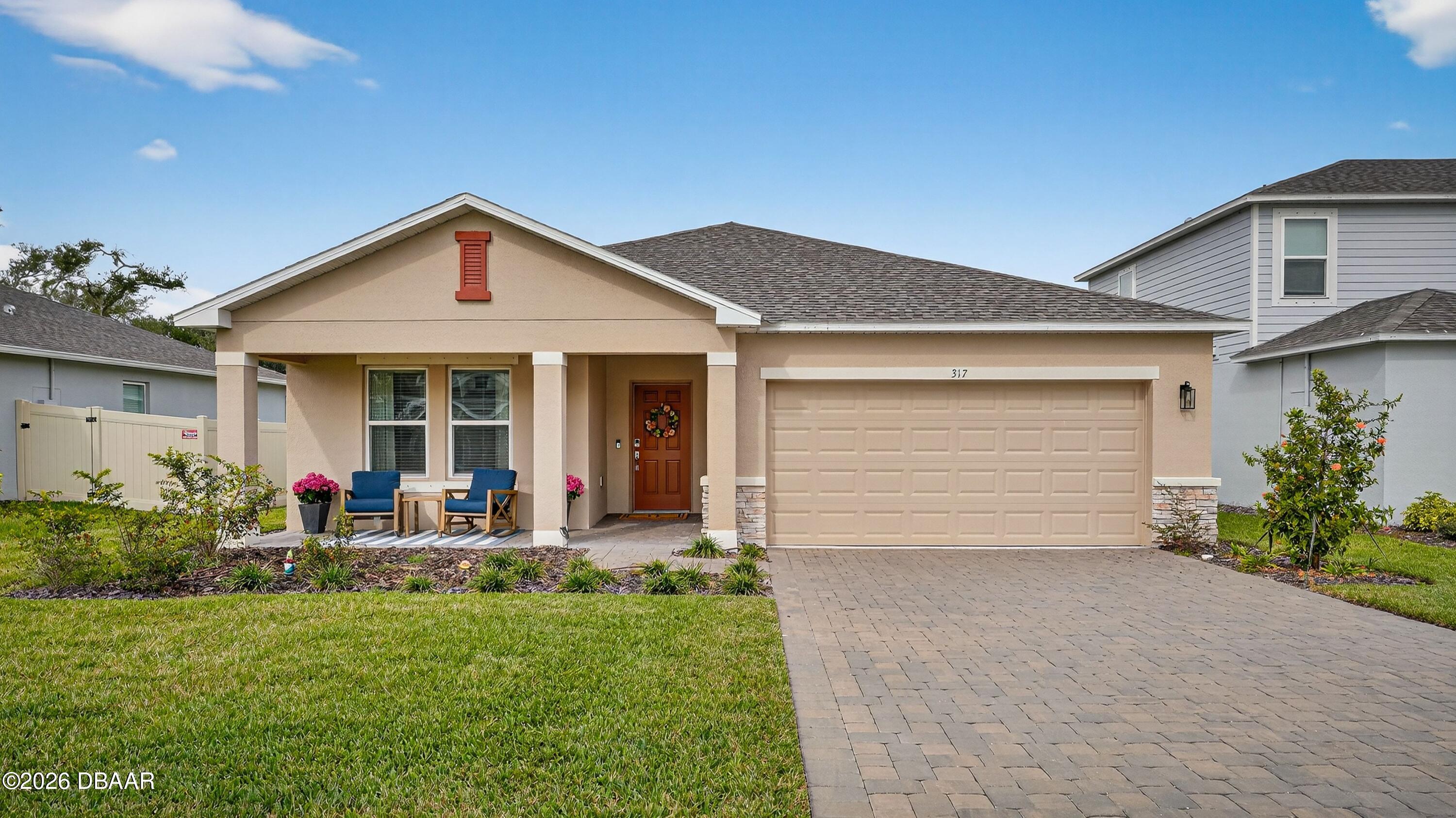 front view of a house with a yard