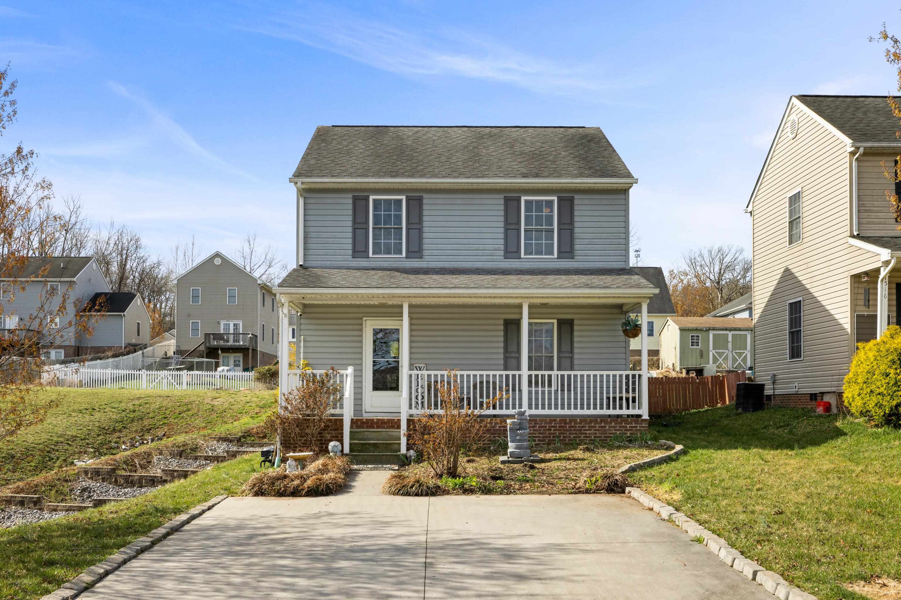 1520 3rd Street Waynesboro, VA 22980 - Photo 2 of 55 a front view of a house with a yard table and chairs
