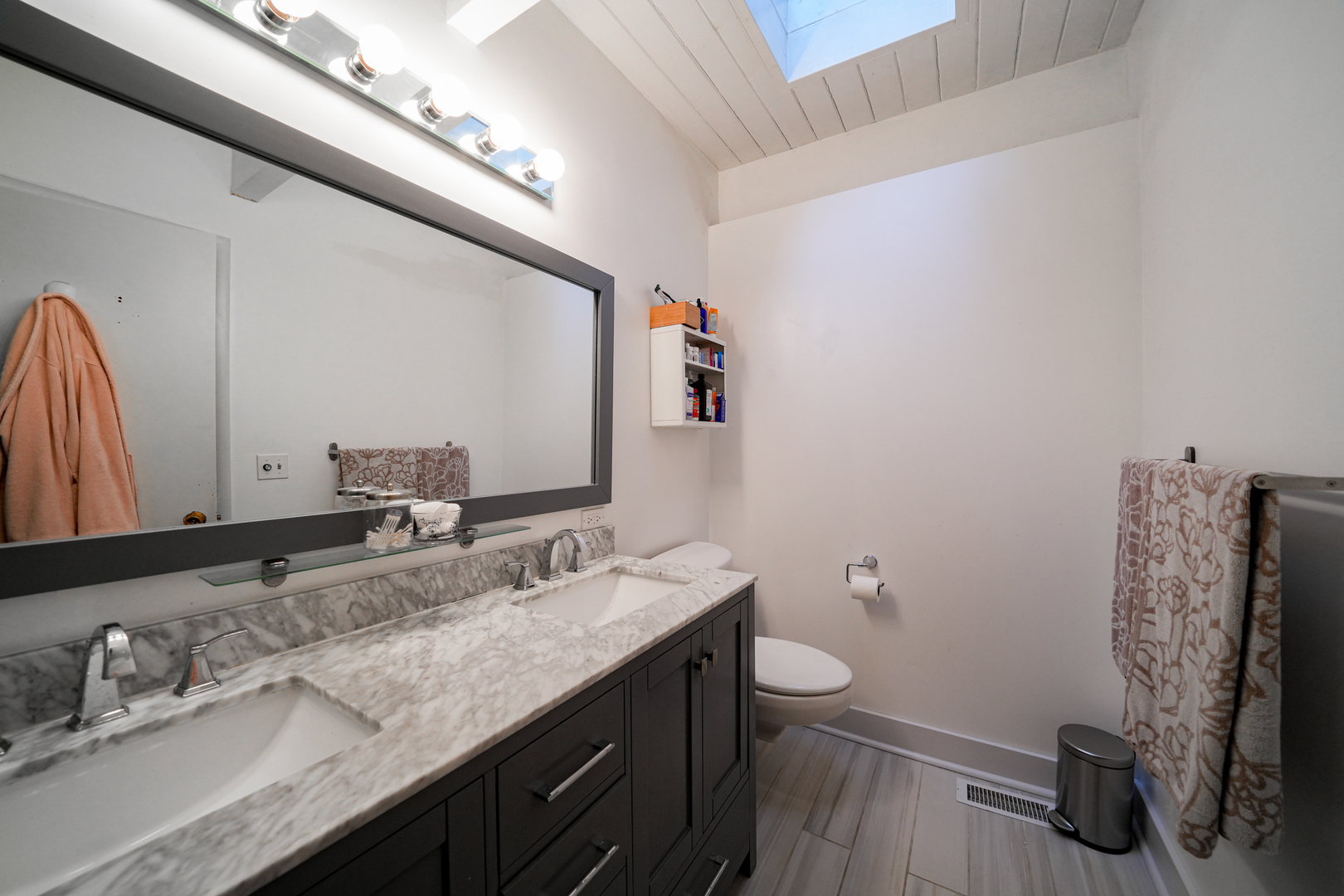 916 Forest Drive Elgin, IL 60123 - Photo 12 of 26 a bathroom with a granite countertop sink a toilet and a mirror