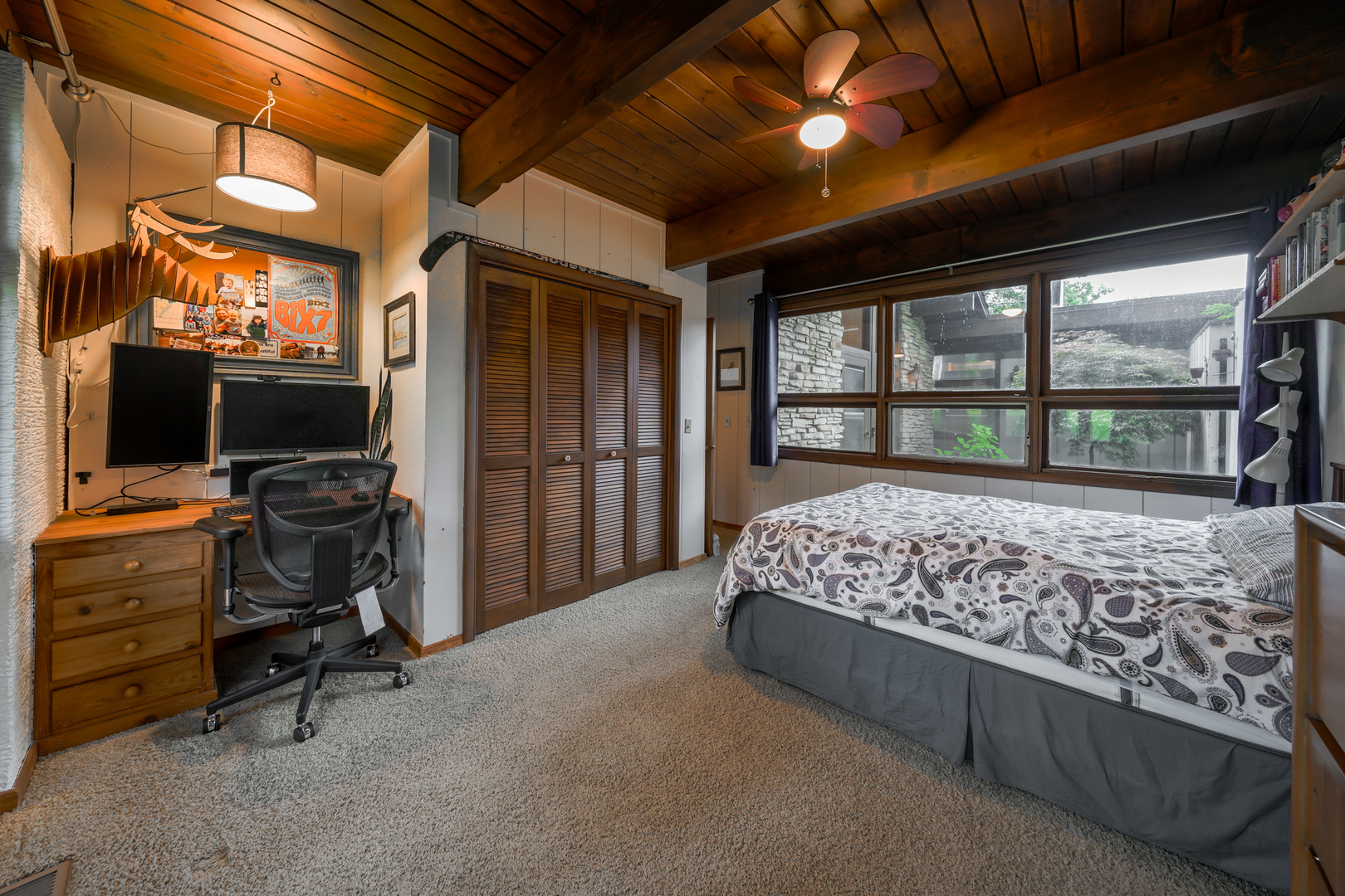 916 Forest Drive Elgin, IL 60123 - Photo 6 of 26 a bed sitting in a room next to a window