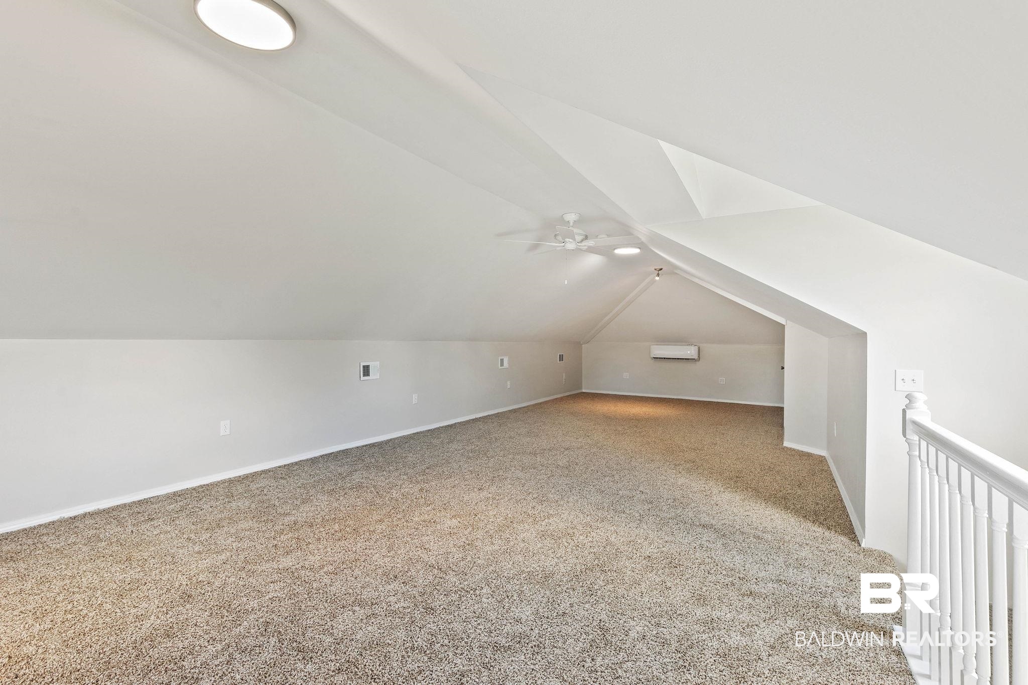 35650 Spring Road North Stapleton, AL 36578 - Photo 52 of 70 Additional living space featuring carpet floors, vaulted ceiling, and ceiling fan