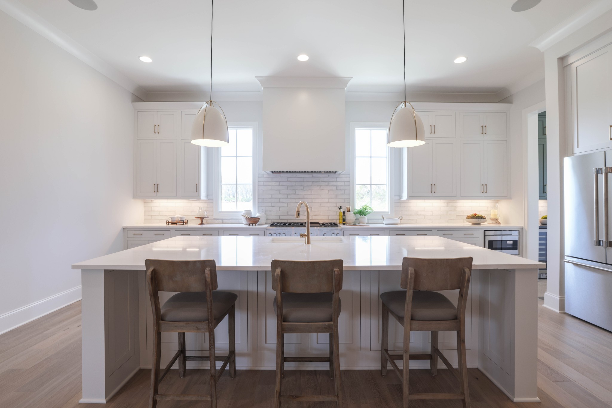 657 Jackson Falls Drive Nashville, TN 37221 - Photo 13 of 63 a kitchen with kitchen island cabinets and chairs