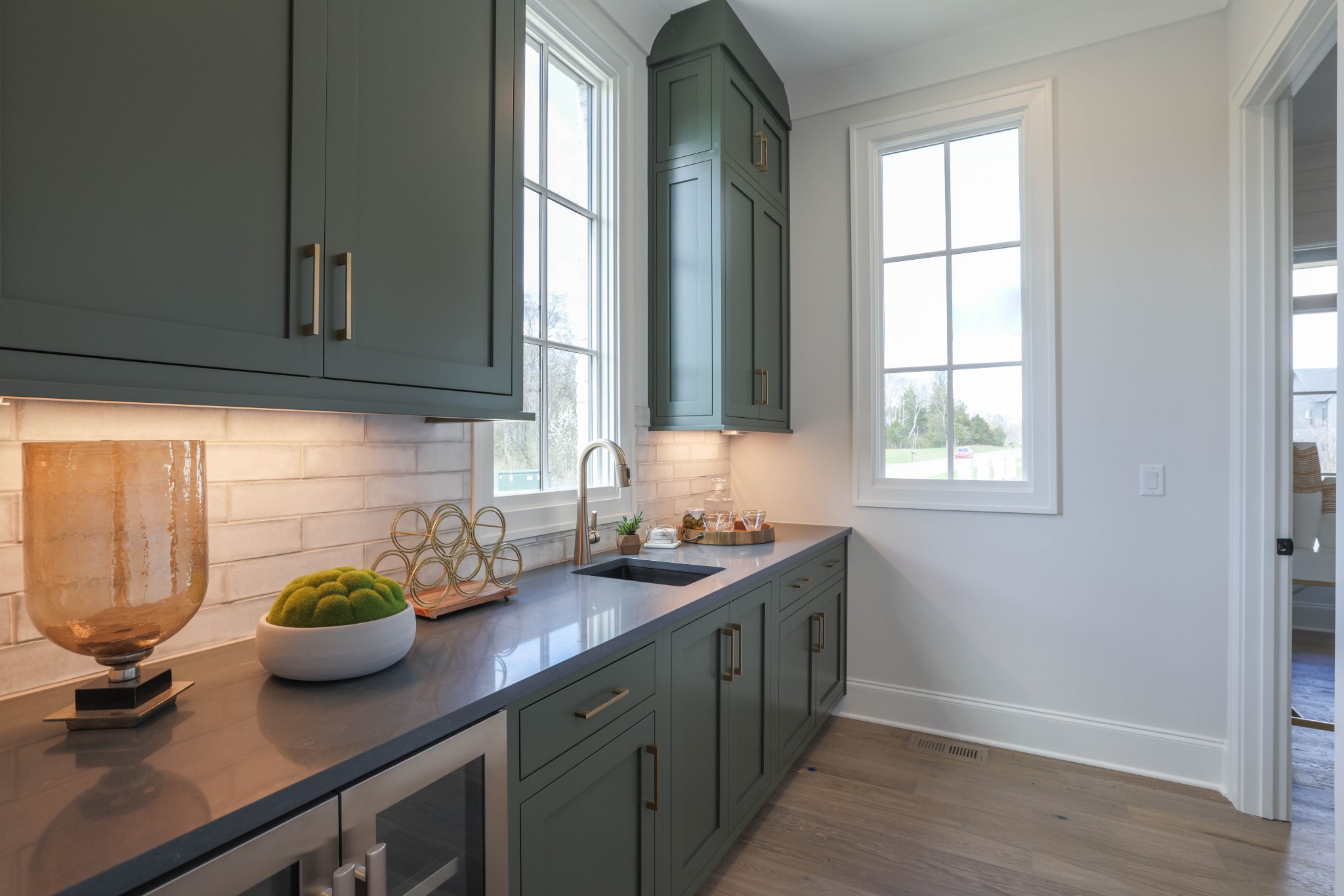 657 Jackson Falls Drive Nashville, TN 37221 - Photo 16 of 63 a kitchen with stainless steel appliances a sink a counter cabinets and a window
