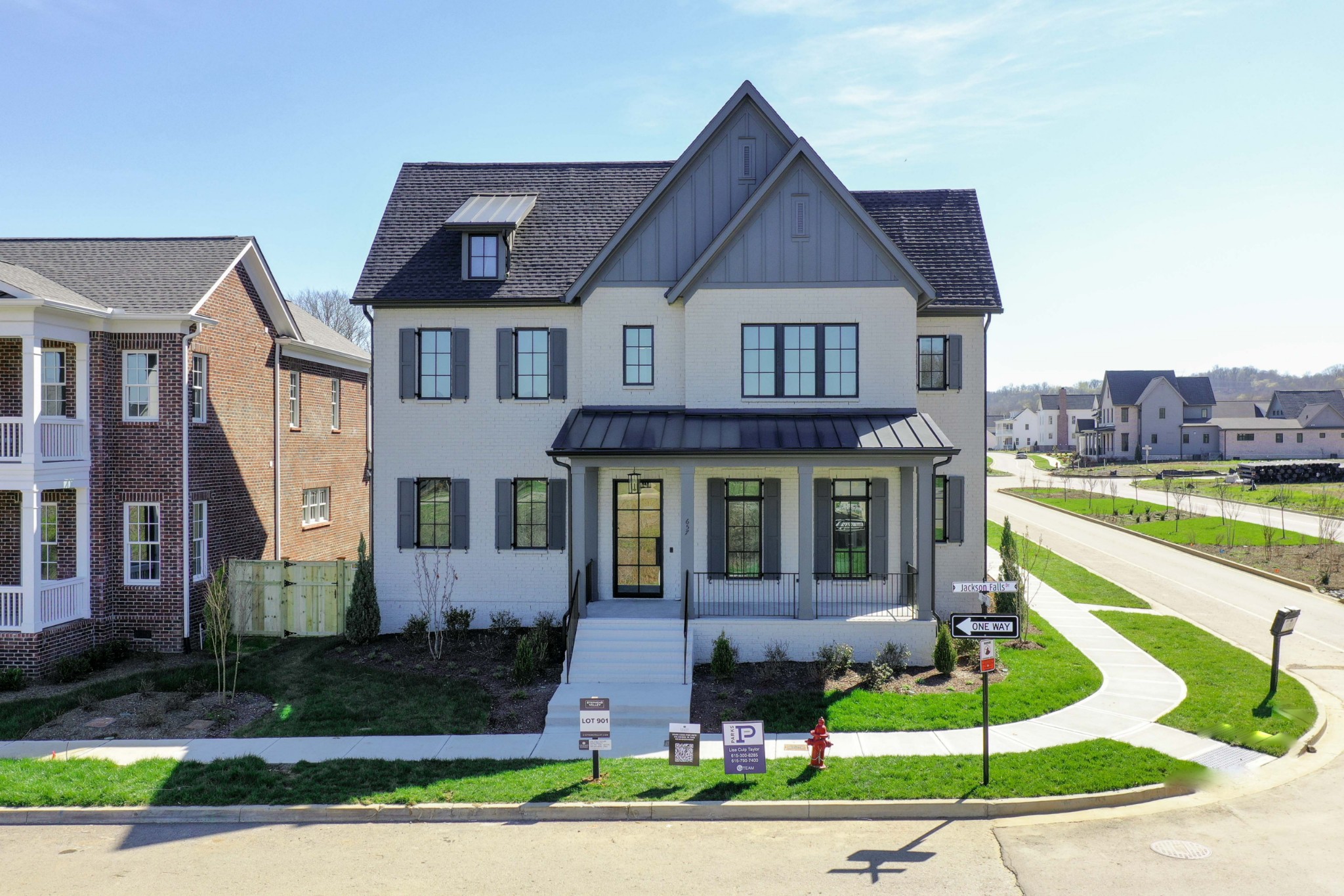 657 Jackson Falls Drive Nashville, TN 37221 - Photo 2 of 63 a front view of a house with a yard