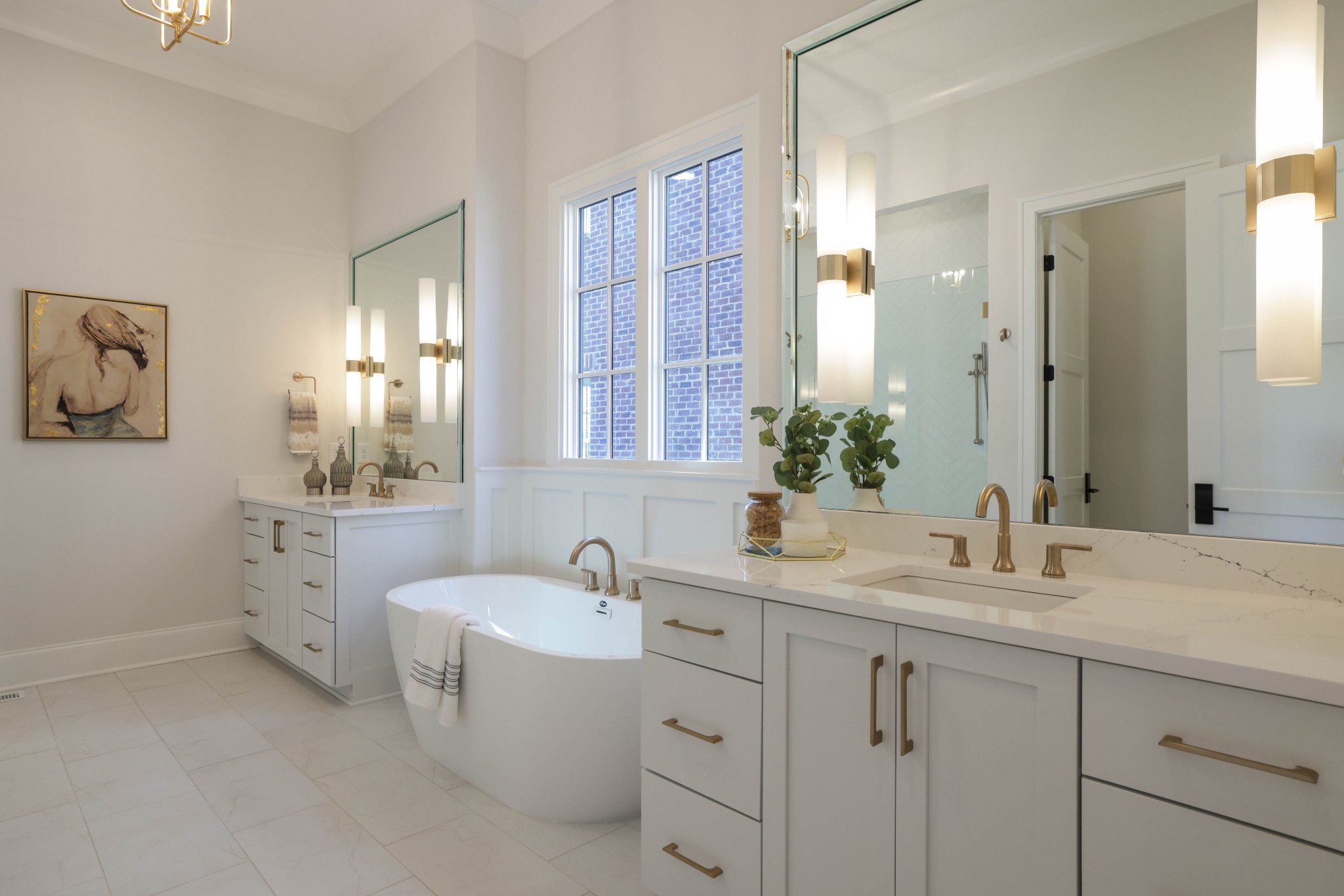 657 Jackson Falls Drive Nashville, TN 37221 - Photo 22 of 63 a bathroom with double vanity sink a mirror and a bathtub