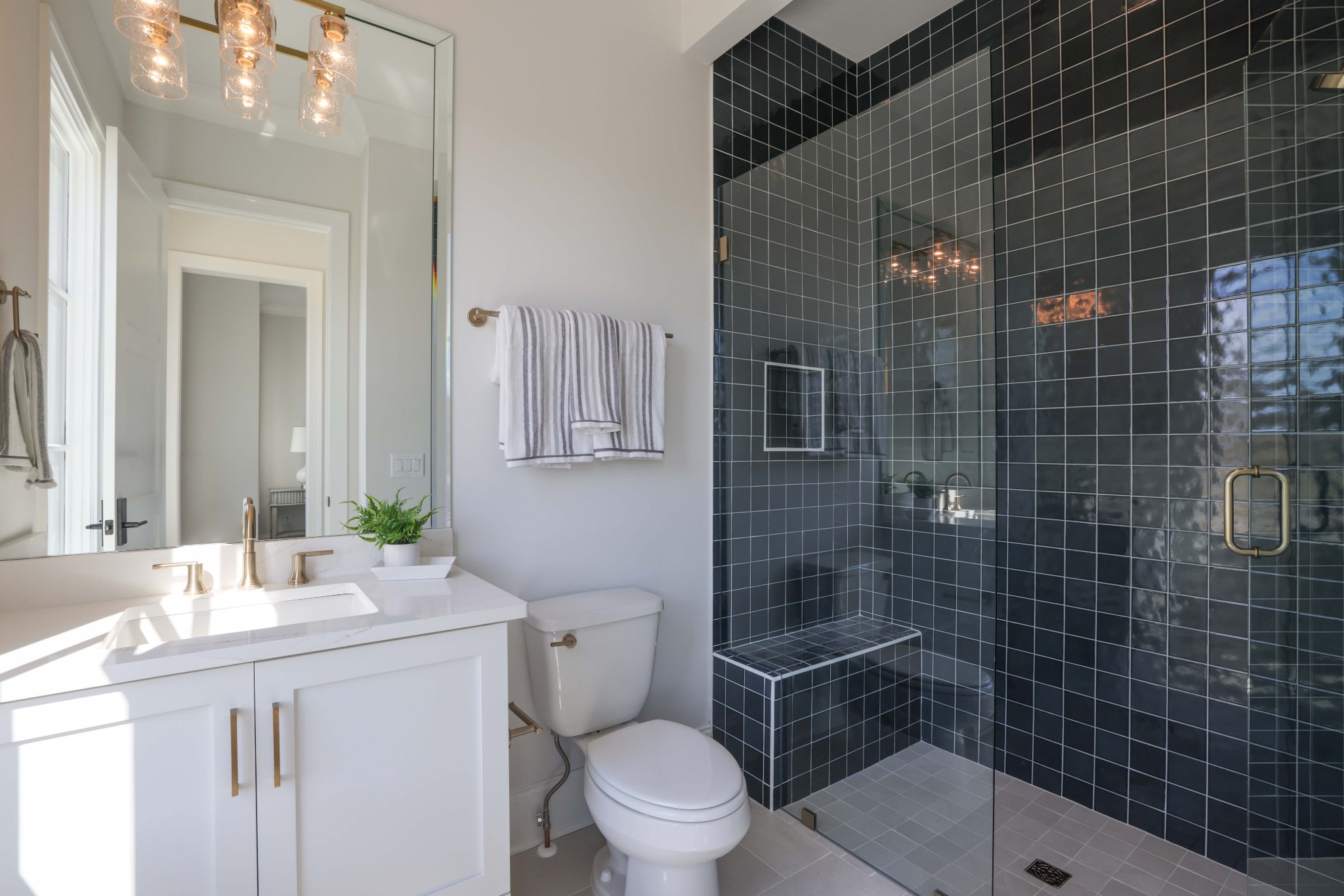 657 Jackson Falls Drive Nashville, TN 37221 - Photo 36 of 63 a bathroom with a sink a toilet and shower