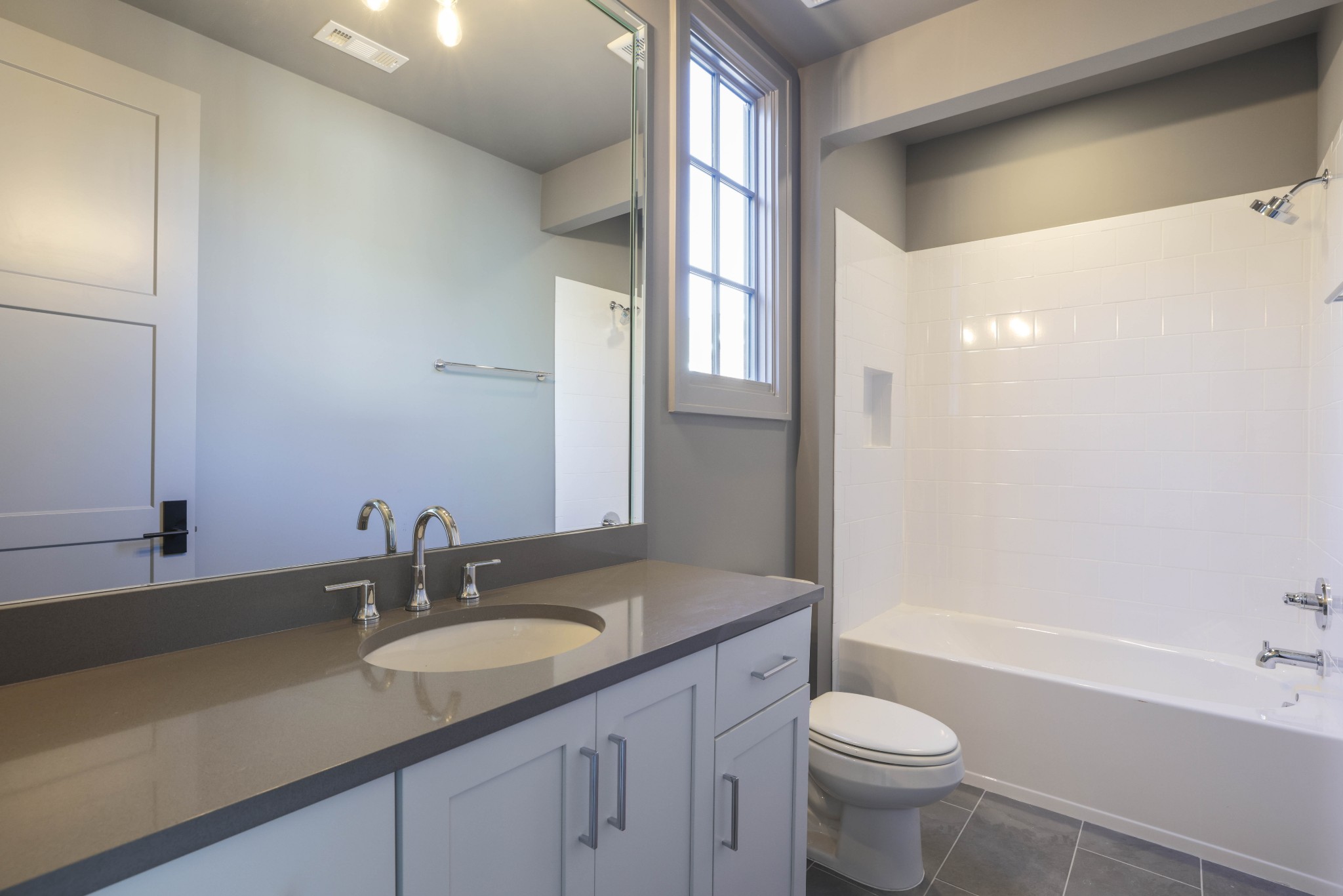 657 Jackson Falls Drive Nashville, TN 37221 - Photo 41 of 63 a bathroom with a granite countertop sink toilet and shower