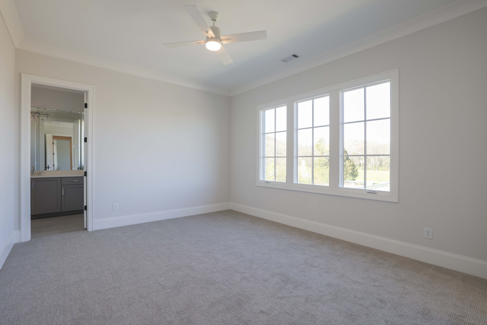 657 Jackson Falls Drive Nashville, TN 37221 - Photo 46 of 63 an empty room with a window and a ceiling fan