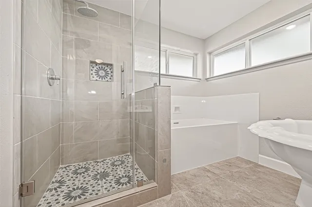 an empty room with closet and fan