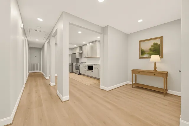 a stove top oven sitting inside of a kitchen