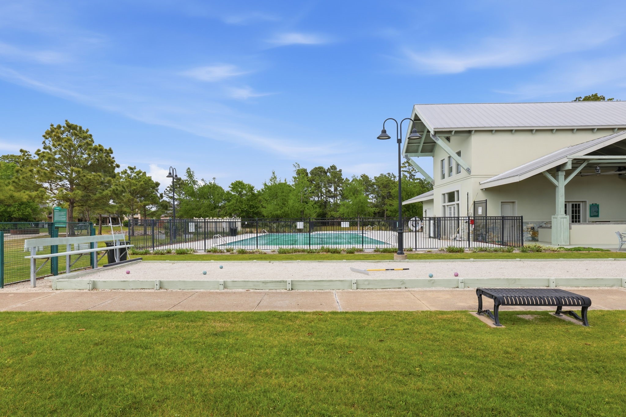 8169 Tranquil Lake Way Conroe, TX 77385 - Photo 25 of 26 a swimming pool with outdoor seating and yard