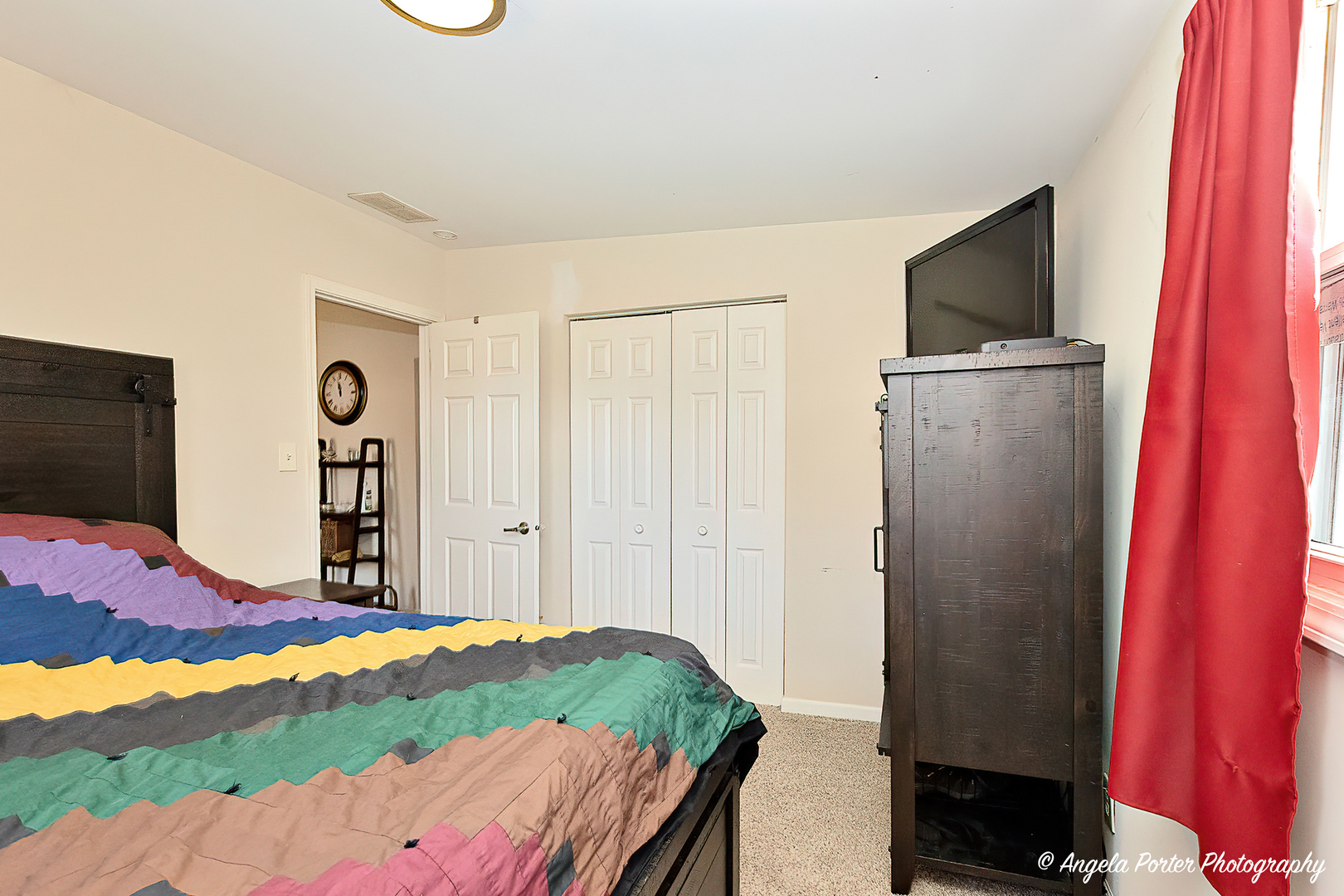 37830 North Watts Avenue Spring Grove, IL 60081 - Photo 14 of 20 a bedroom with a bed and a flat screen tv