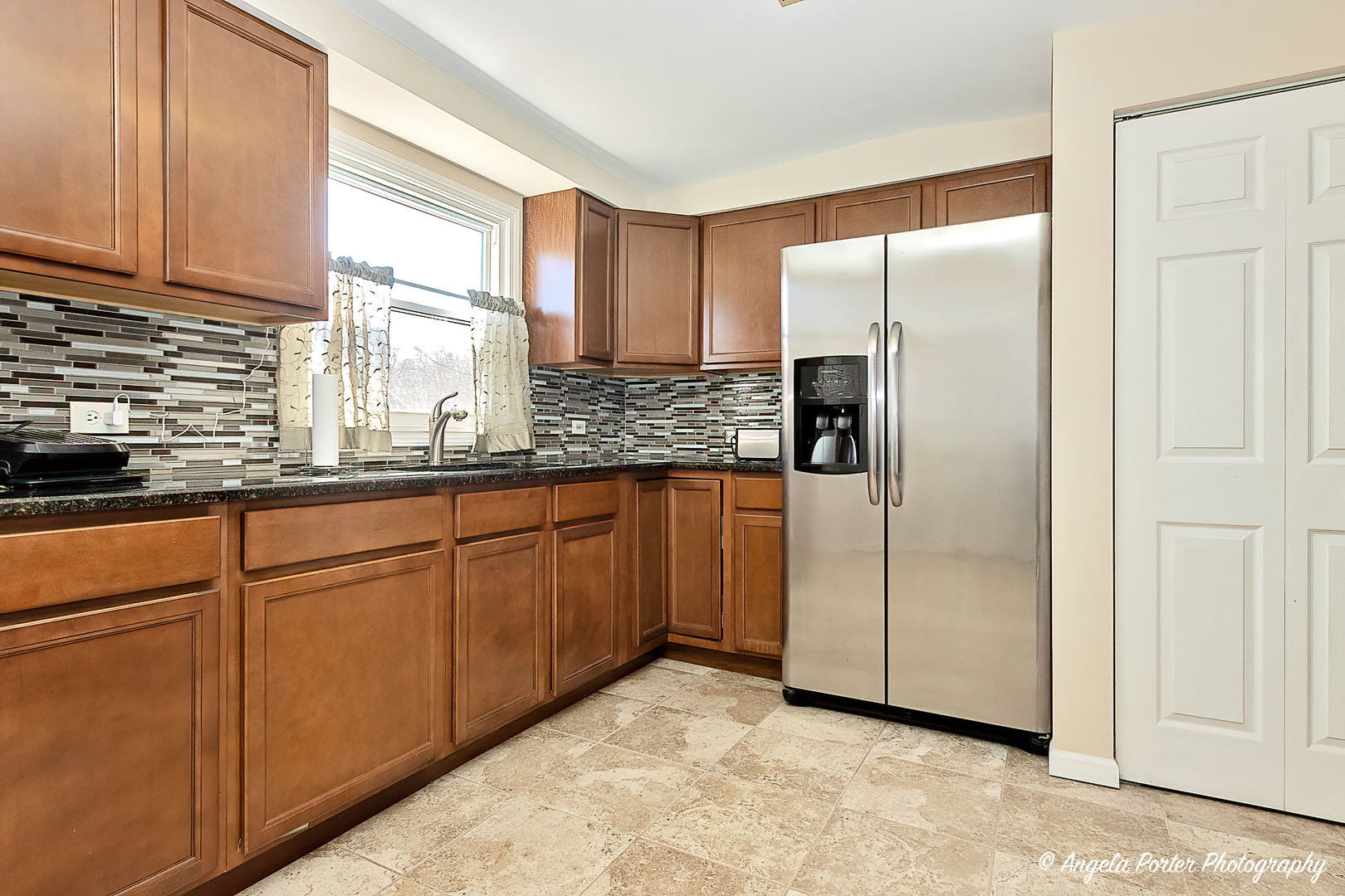37830 North Watts Avenue Spring Grove, IL 60081 - Photo 5 of 20 a kitchen with stainless steel appliances granite countertop white cabinets and refrigerator