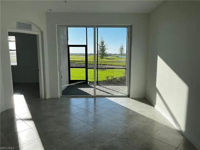 a view of an empty room and window
