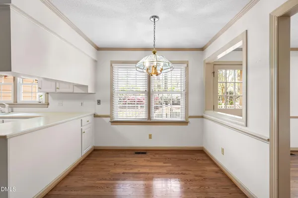 a kitchen with stainless steel appliances a stove top oven and cabinets