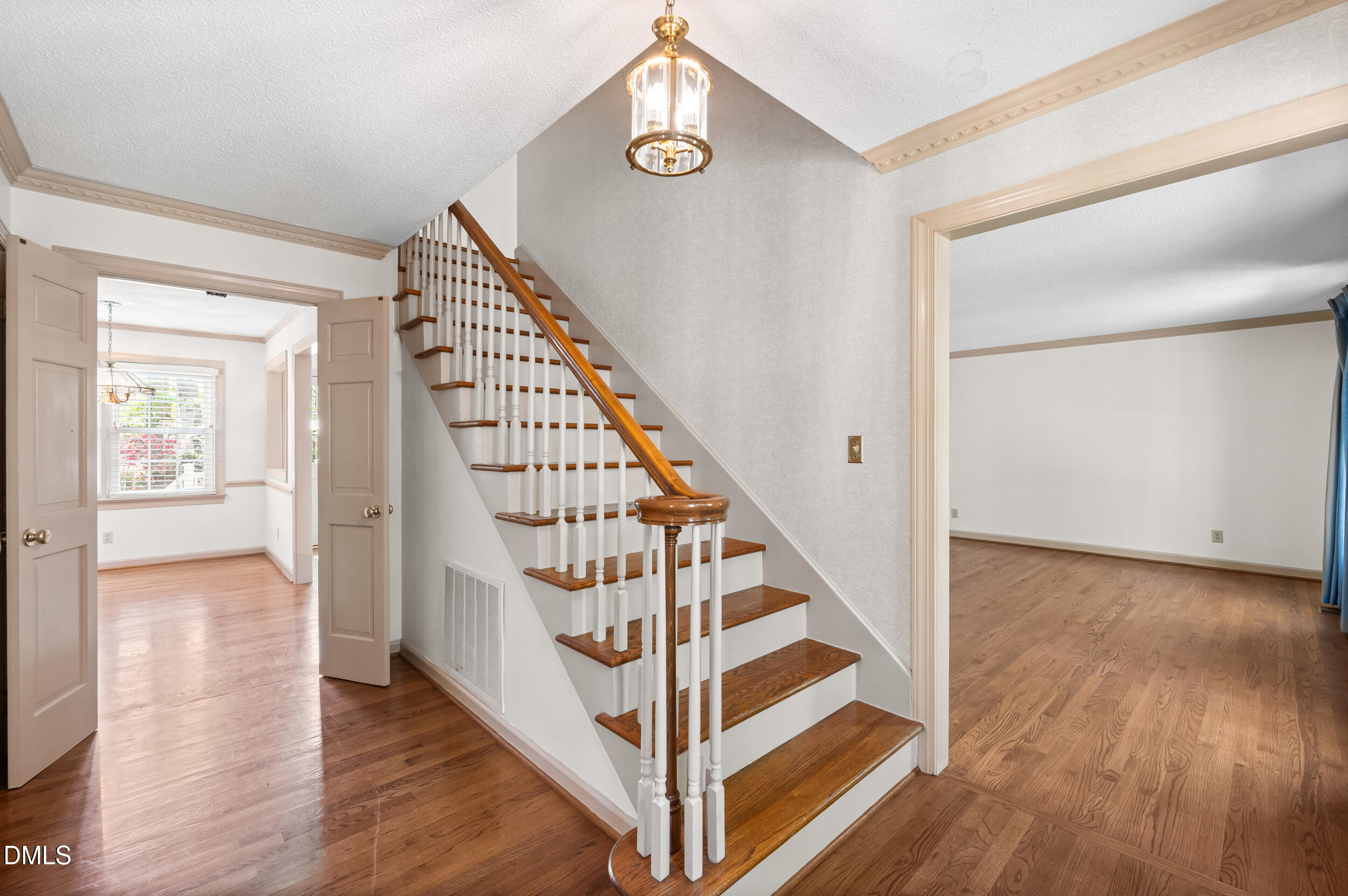 109 Queensferry Road Cary, NC 27511 - Photo 13 of 48 a view of entryway and hall with wooden floor