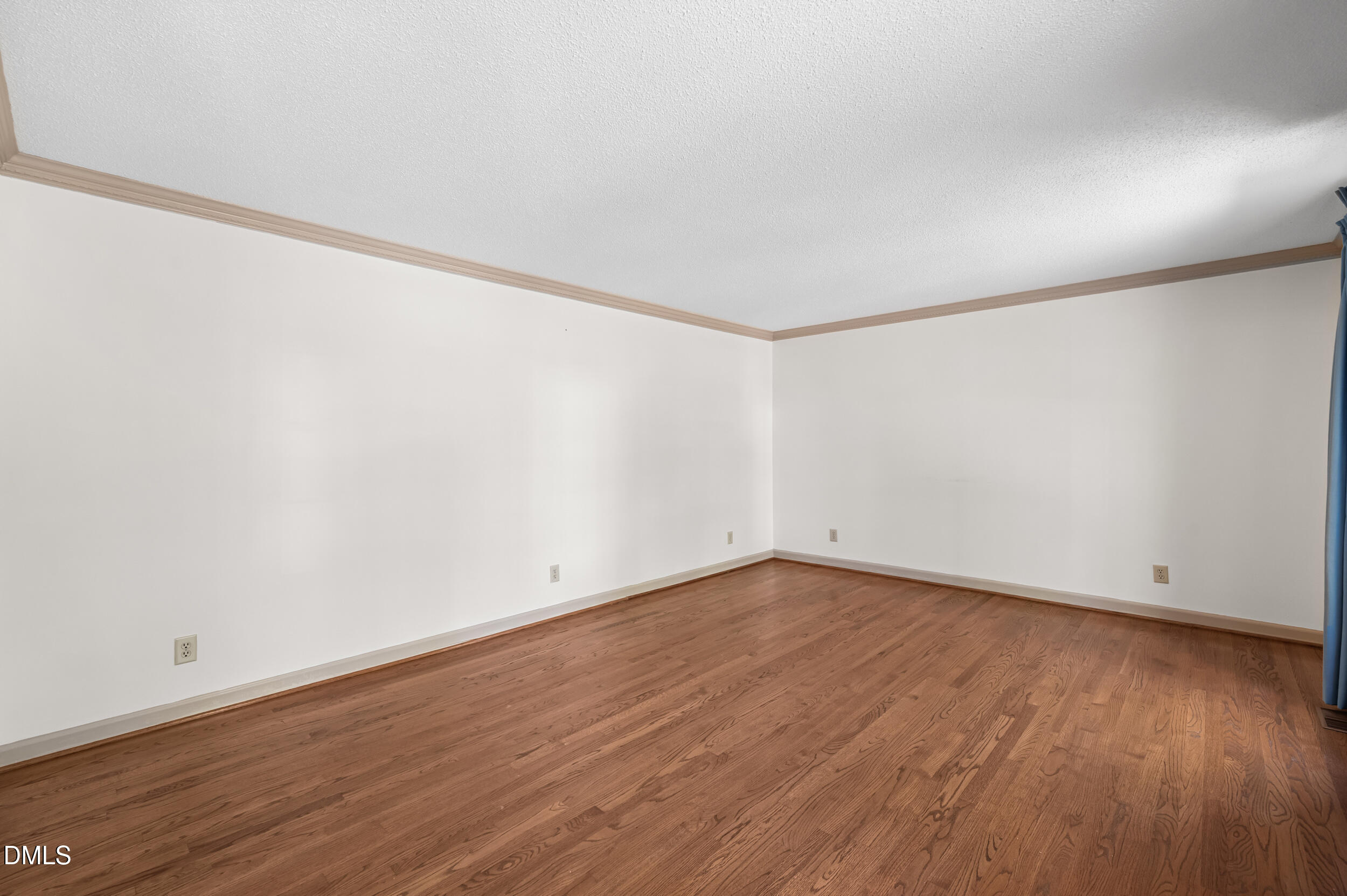 109 Queensferry Road Cary, NC 27511 - Photo 15 of 48 a view of an empty room with wooden floor