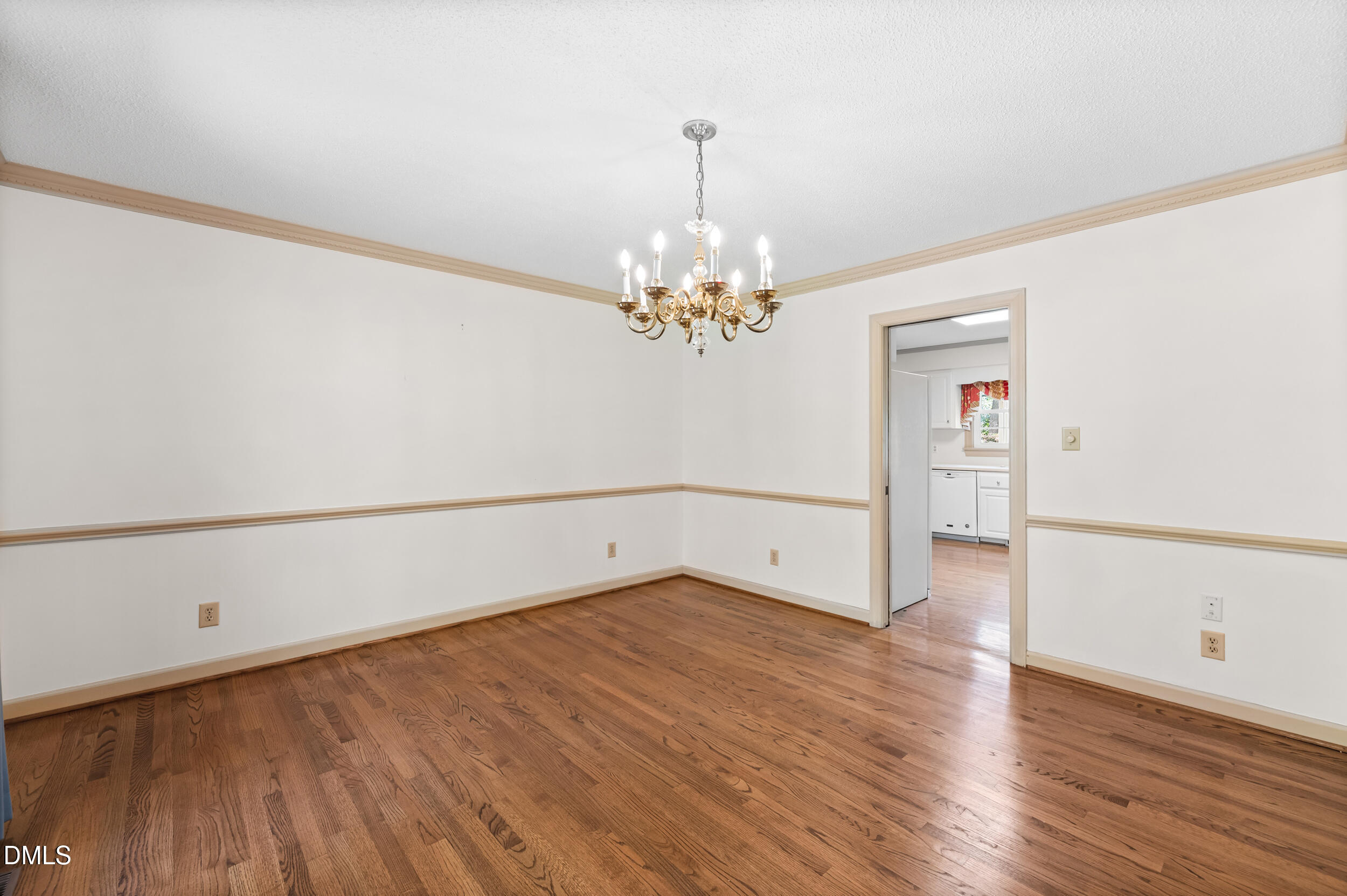 109 Queensferry Road Cary, NC 27511 - Photo 19 of 48 a view of a room with wooden floor and chandelier