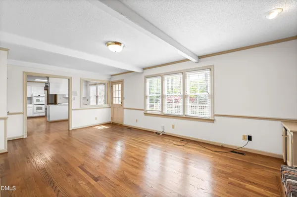 a spacious bedroom with a bed and a couch