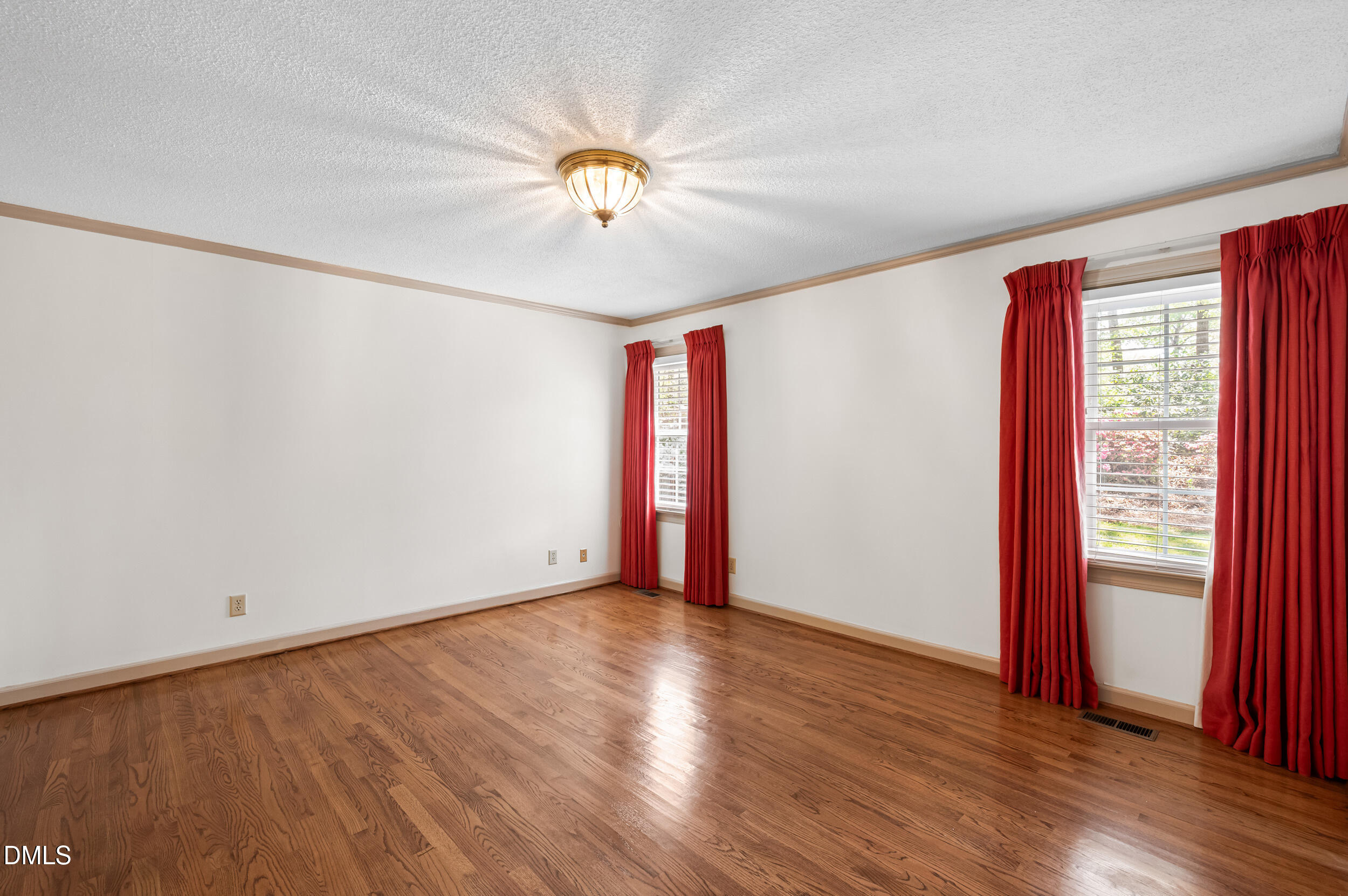 109 Queensferry Road Cary, NC 27511 - Photo 24 of 48 an empty room with wooden floor and windows