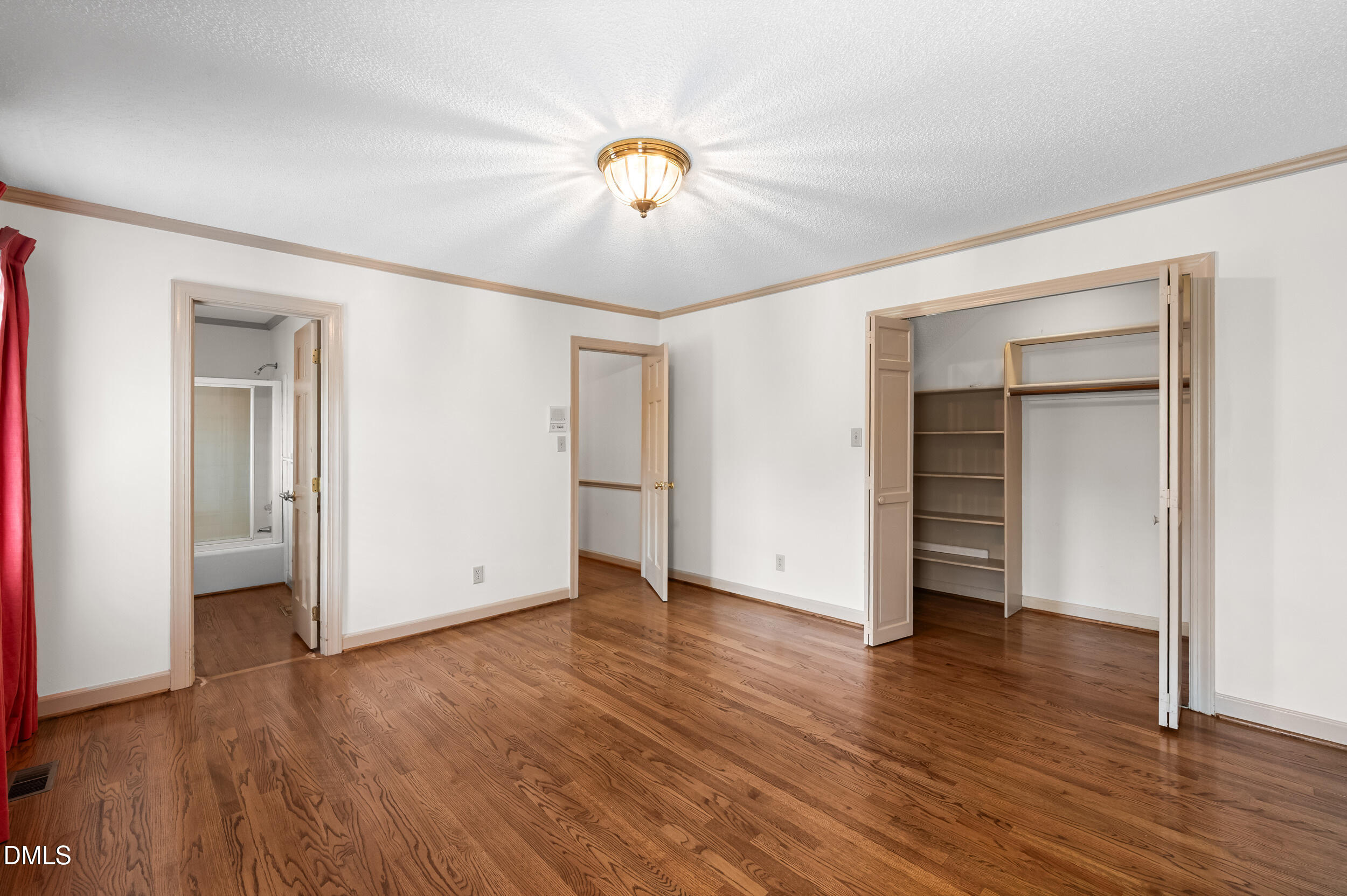 109 Queensferry Road Cary, NC 27511 - Photo 25 of 48 a view of an empty room with wooden floor and closet