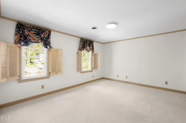 a bathroom with a double vanity sink and mirror