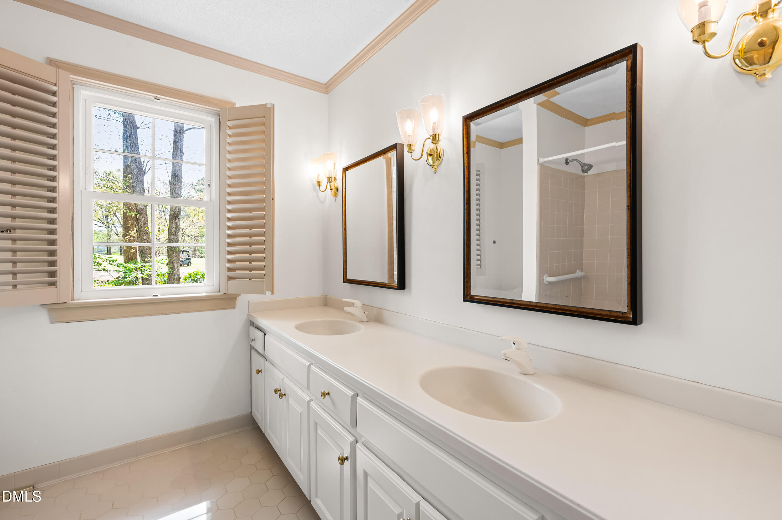 109 Queensferry Road Cary, NC 27511 - Photo 31 of 48 a bathroom with a double vanity sink and mirror