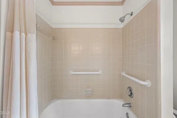 an empty room with windows and stairs