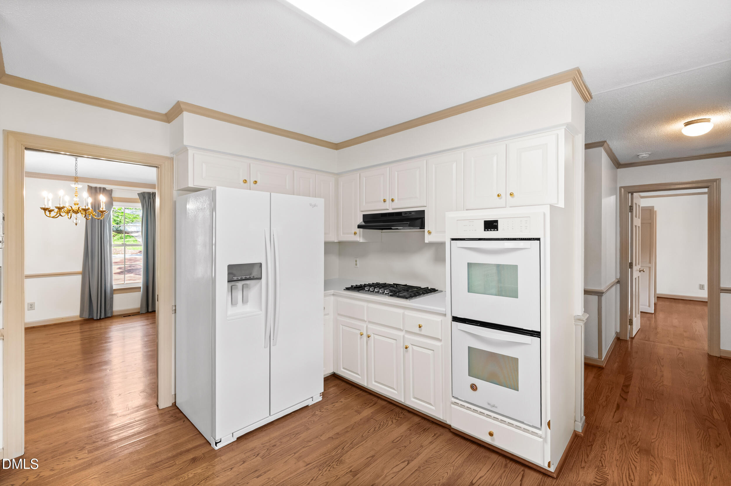 109 Queensferry Road Cary, NC 27511 - Photo 7 of 48 a kitchen with white cabinets and white appliances