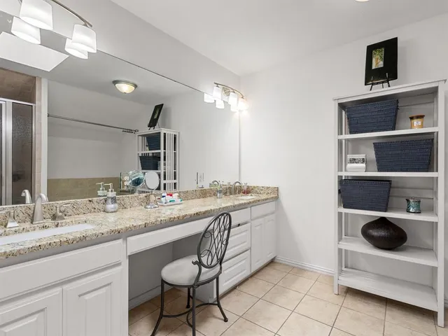 a bathroom with a sink double vanity and a mirror