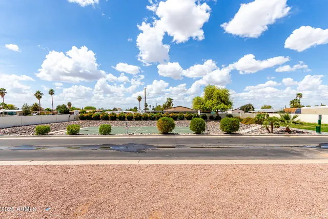 a view of a basket ball ground and a building in the background