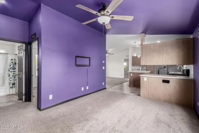 a view of a kitchen with a stove and a kitchen island