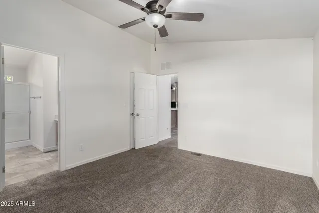 a view of a chandelier fan in a room