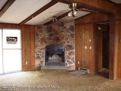 Rr1 Rr1 Montrose, PA 18801 - Photo 2 of 9 a view of an empty room with a fireplace