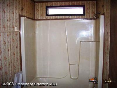Rr1 Rr1 Montrose, PA 18801 - Photo 3 of 9 a bathroom with a glass shower door