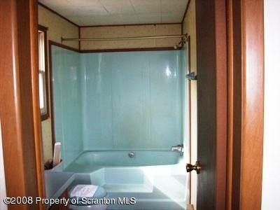 Rr1 Rr1 Montrose, PA 18801 - Photo 7 of 9 a bathroom with a glass shower door