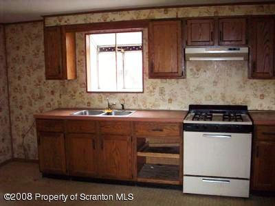 Rr1 Rr1 Montrose, PA 18801 - Photo 8 of 9 a white stove top oven sitting inside of a kitchen