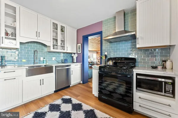 a kitchen with granite countertop cabinets and steel stainless steel appliances