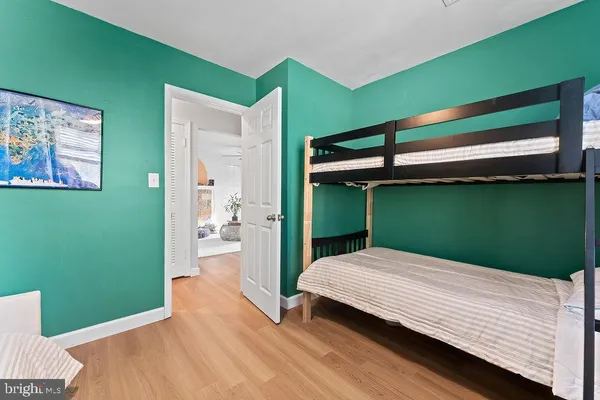 a bedroom with a bed and a view of bedroom