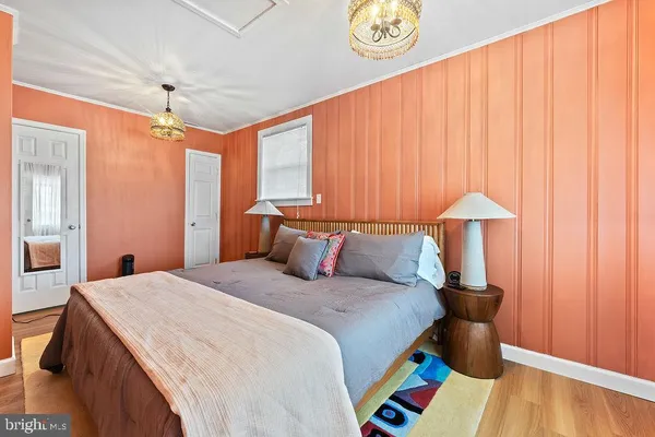 a bedroom with a bed and a table in it