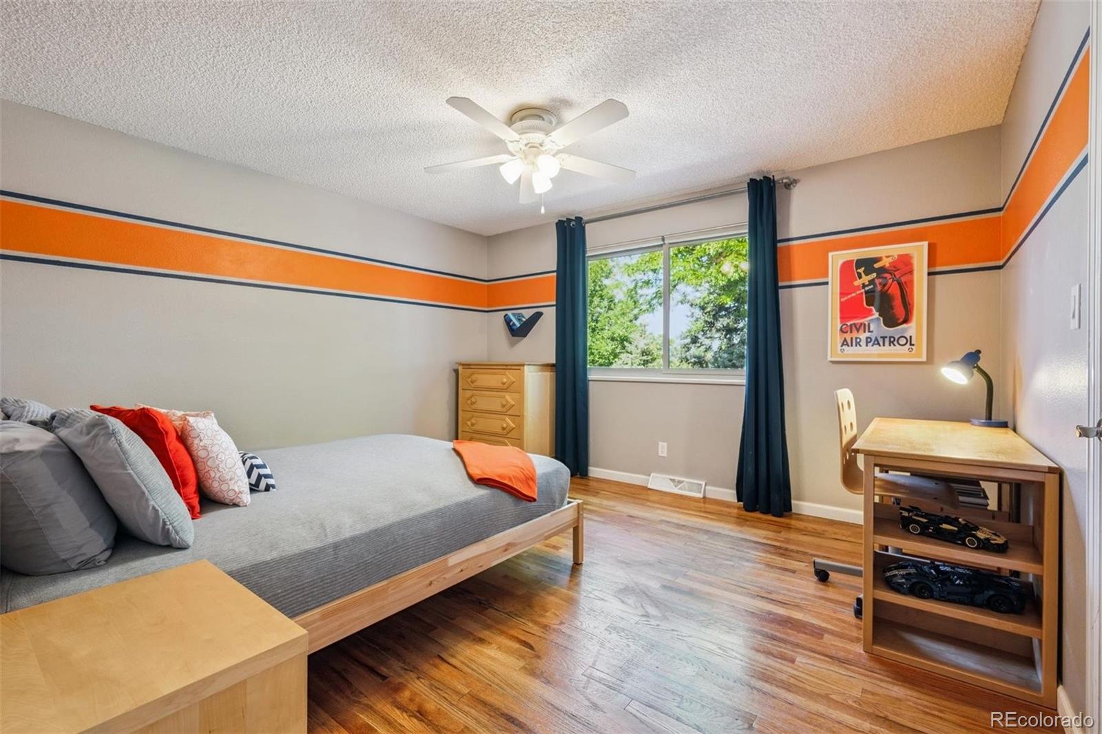 7659 South Fillmore Way Centennial, CO 80122 - Photo 22 of 45 a bedroom with furniture and a large window