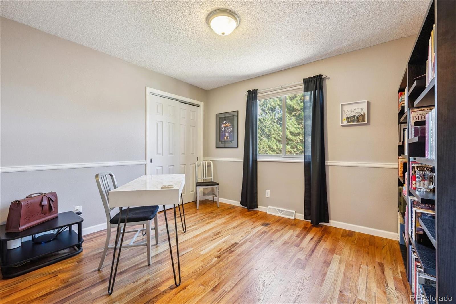 7659 South Fillmore Way Centennial, CO 80122 - Photo 24 of 45 a workspace with furniture hardwood and a window