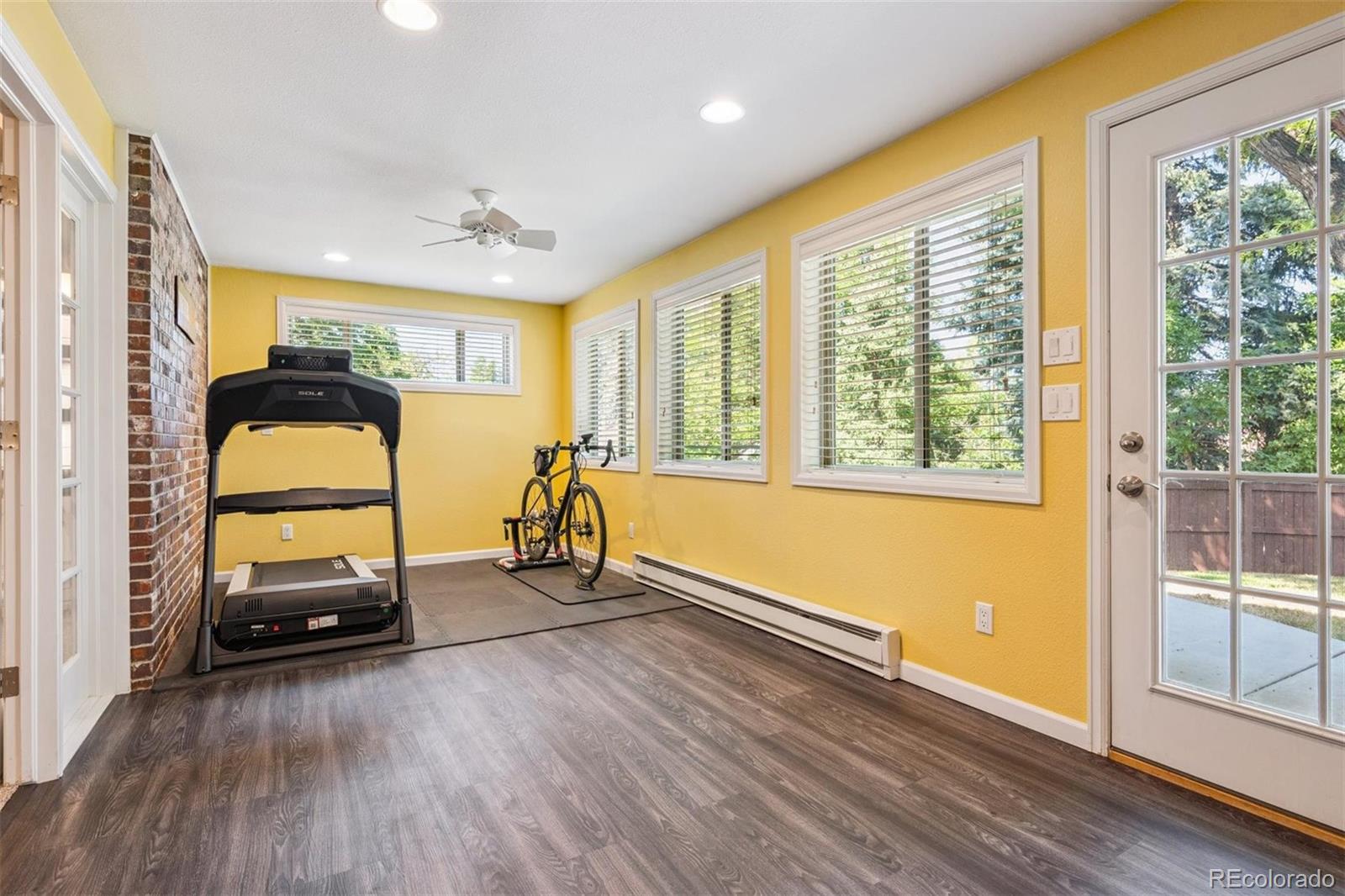 7659 South Fillmore Way Centennial, CO 80122 - Photo 27 of 45 a view of a livingroom with wooden floor and a window