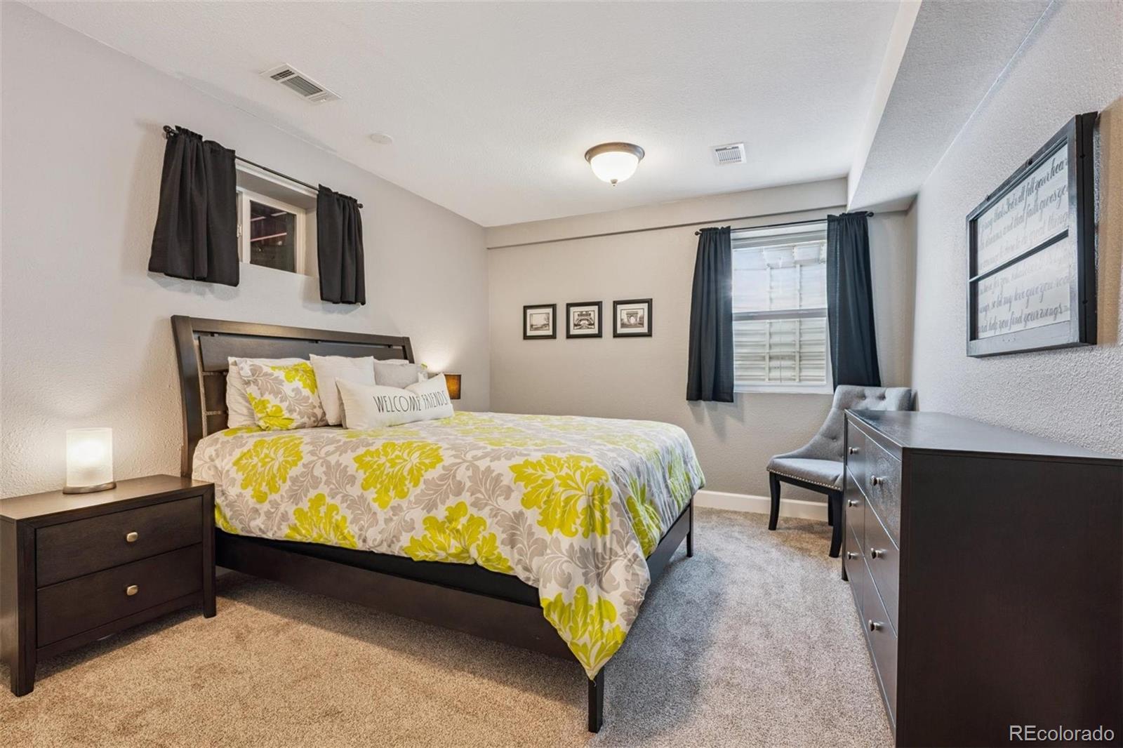 7659 South Fillmore Way Centennial, CO 80122 - Photo 30 of 45 a bedroom with a bed and window