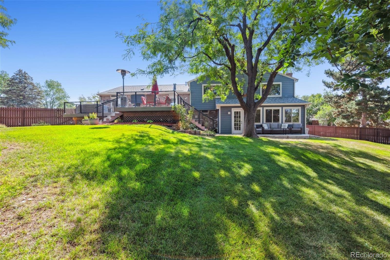 7659 South Fillmore Way Centennial, CO 80122 - Photo 39 of 45 a house view with a sitting space and garden