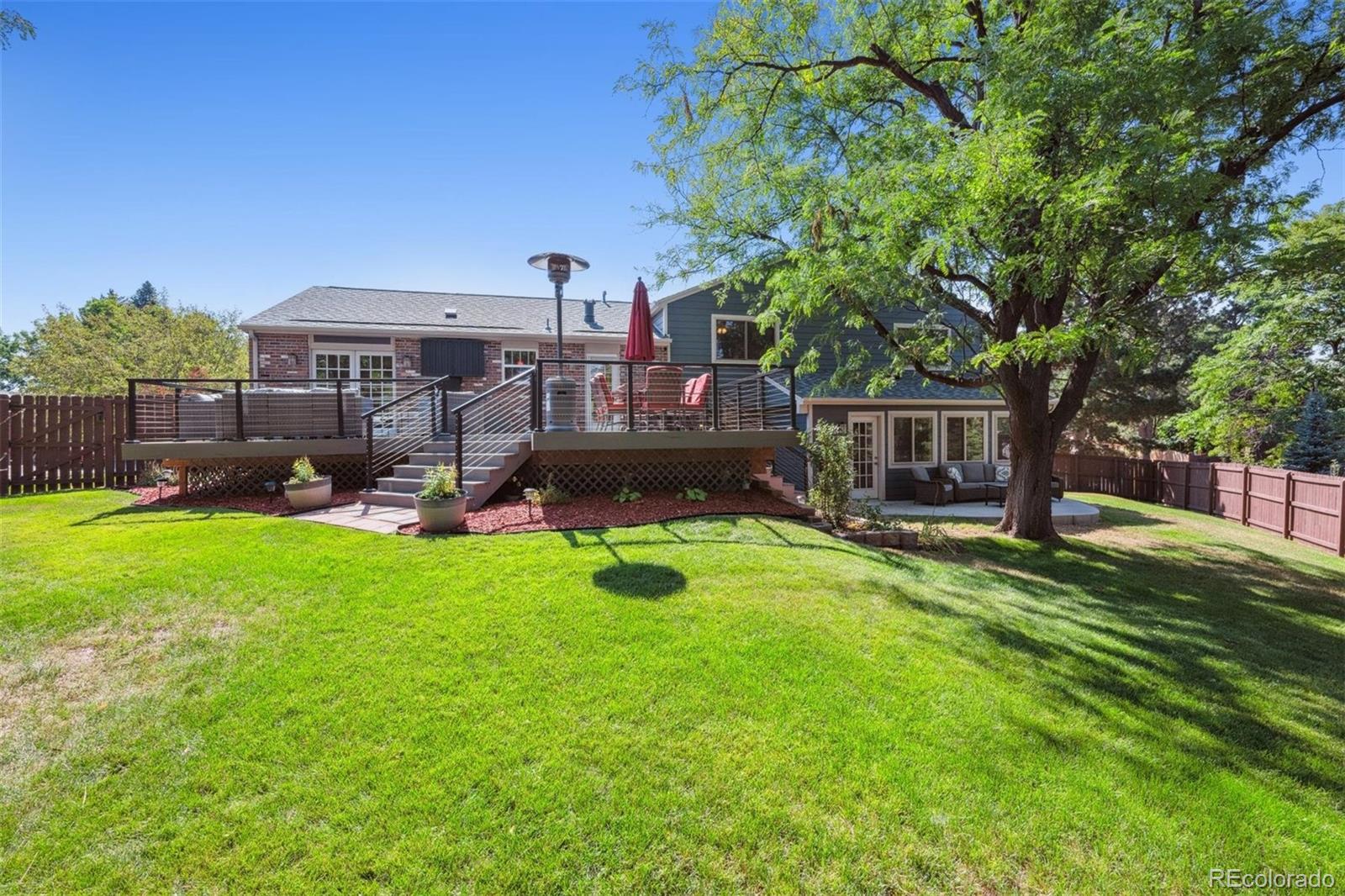 7659 South Fillmore Way Centennial, CO 80122 - Photo 40 of 45 a front view of a house with garden