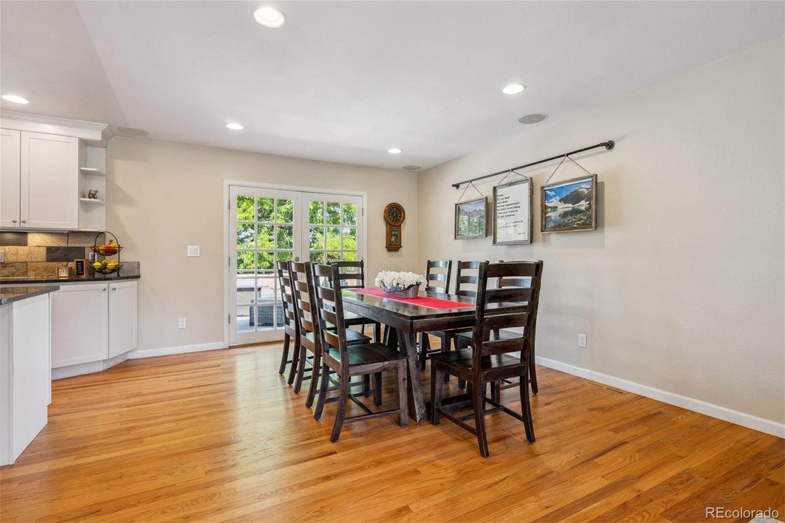 7659 South Fillmore Way Centennial, CO 80122 - Photo 7 of 45 a view of a dining room with furniture and wooden floor